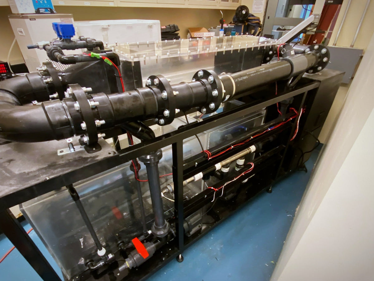 Aquafab flow chamber with pumps and plumbing in a research lab